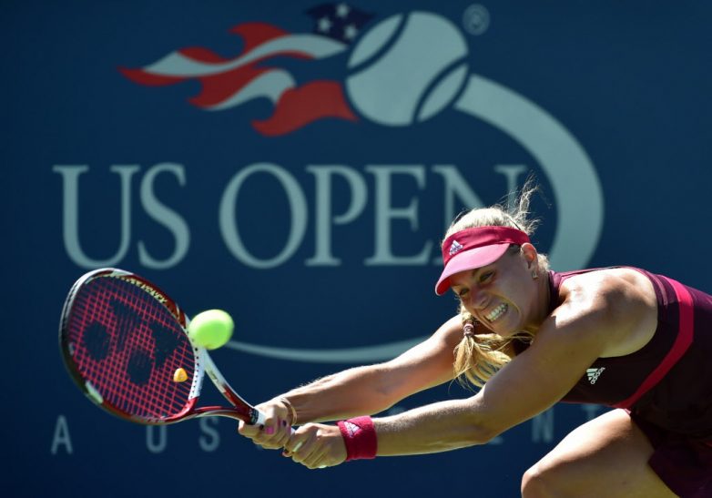 Angelique Kerber of Germany returns a shot to Ksenia Pervak of Russia during their 2014 US Open women's singles match at the USTA Billie Jean King National Tennis Center August 25, 2014 in New York. AFP PHOTO/Stan HONDASTAN HONDA/AFP/Getty Images ORG XMIT: 507840207